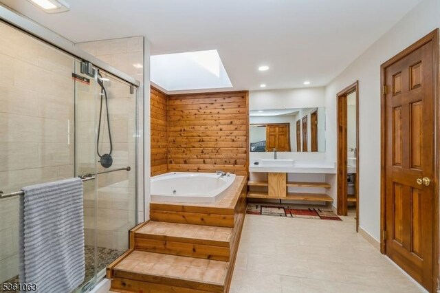 30 Claridge Ln, Raritan Twp, NJ 08822 - bathroom with a skylight, a whirlpool tub, a shower stall, vanity, and recessed lighting