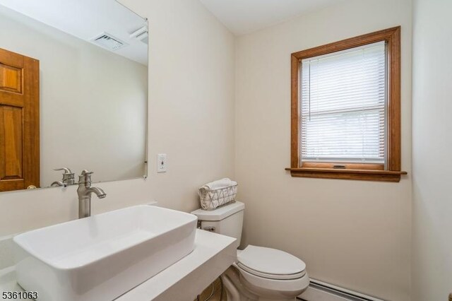 30 Claridge Ln, Raritan Twp, NJ 08822 - bathroom featuring a sink, baseboard heating, and toilet
