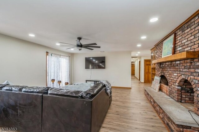 30 Claridge Ln, Raritan Twp, NJ 08822 - living area featuring ceiling fan, recessed lighting, light wood finished floors, a brick fireplace, and baseboards