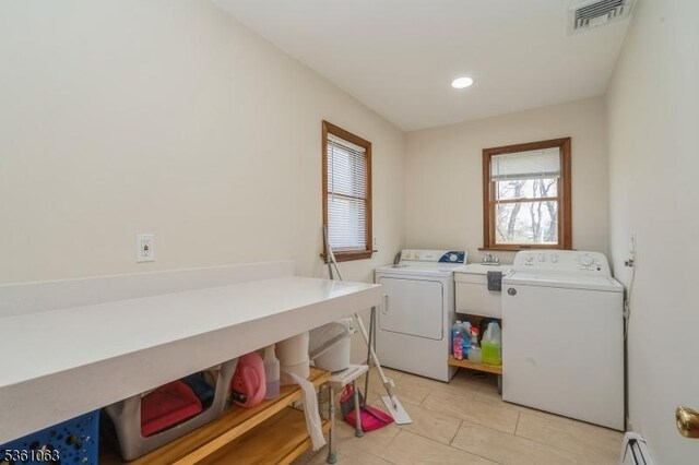 30 Claridge Ln, Raritan Twp, NJ 08822 - laundry area with washer and dryer, light tile patterned flooring, and a baseboard radiator