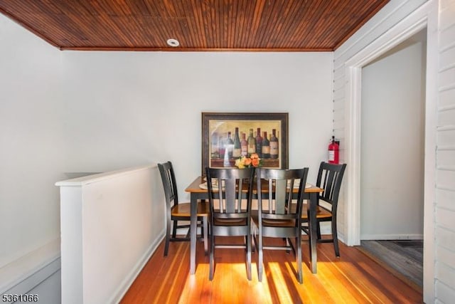 2 Shore Rd, Jefferson Twp, NJ 07849 - dining area featuring ornamental molding, wooden ceiling, wood finished floors, and baseboards