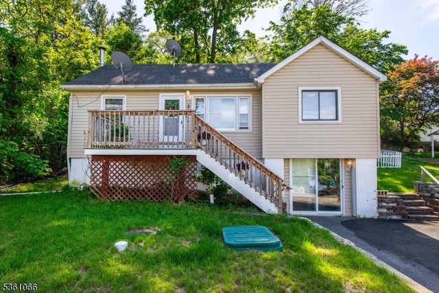 2 Shore Rd, Jefferson Twp, NJ 07849 - rear view of house featuring stairway, a yard, and a wooden deck