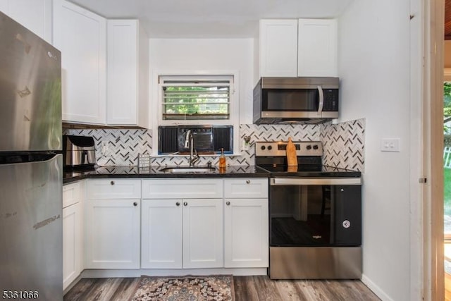 2 Shore Rd, Jefferson Twp, NJ 07849 - kitchen with stainless steel appliances, wood finished floors, and tasteful backsplash