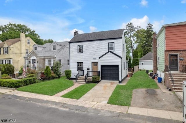 1535 Leslie St, Hillside Twp, NJ 07205 - view of front of house featuring concrete driveway, a front yard, a chimney, and an attached garage
