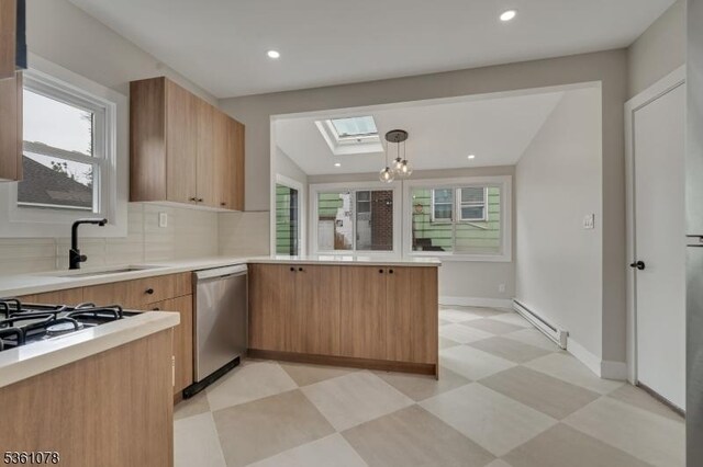 1535 Leslie St, Hillside Twp, NJ 07205 - kitchen featuring dishwasher, a baseboard radiator, a skylight, light floors, and healthy amount of natural light