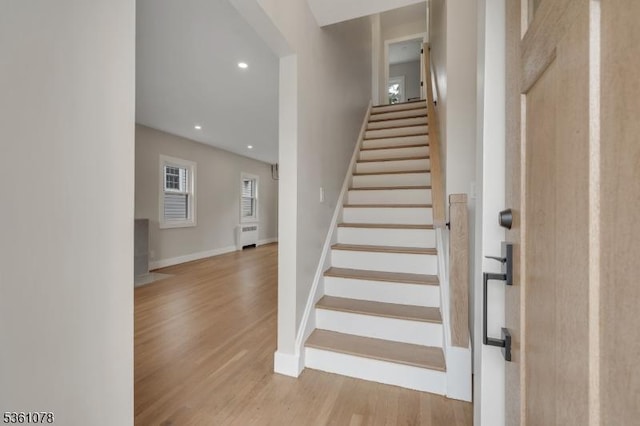 1535 Leslie St, Hillside Twp, NJ 07205 - stairway with radiator, wood finished floors, baseboards, and recessed lighting