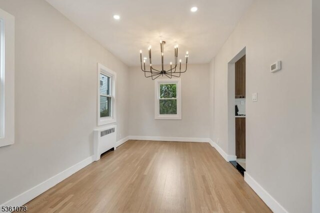1535 Leslie St, Hillside Twp, NJ 07205 - unfurnished dining area featuring radiator, a chandelier, light wood finished floors, recessed lighting, and baseboards