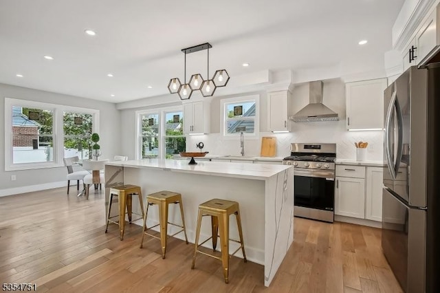 223 Victor St, Scotch Plains Twp, NJ 07076 - kitchen with stainless steel appliances, wall chimney range hood, a sink, white cabinetry, and recessed lighting