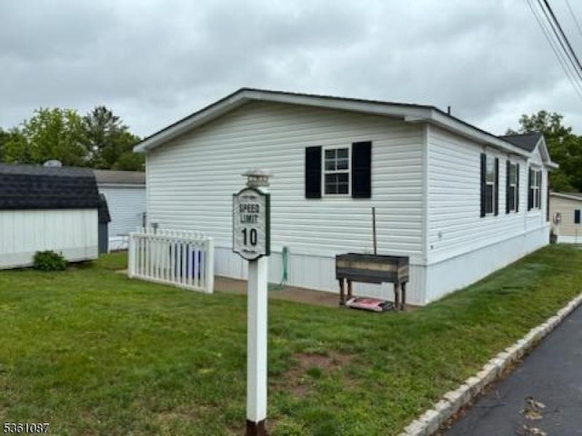 512 Kenbury Rd, Branchburg Twp, NJ 08876 - view of home's exterior with a lawn