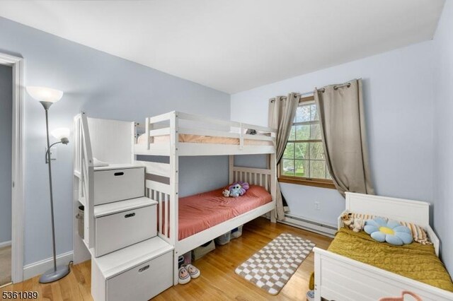 62 Valley View Rd, High Bridge Boro, NJ 08829 - bedroom with light wood finished floors and a baseboard radiator
