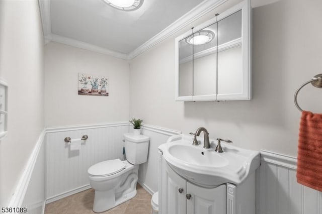 62 Valley View Rd, High Bridge Boro, NJ 08829 - half bathroom featuring crown molding, a wainscoted wall, vanity, toilet, and tile patterned floors