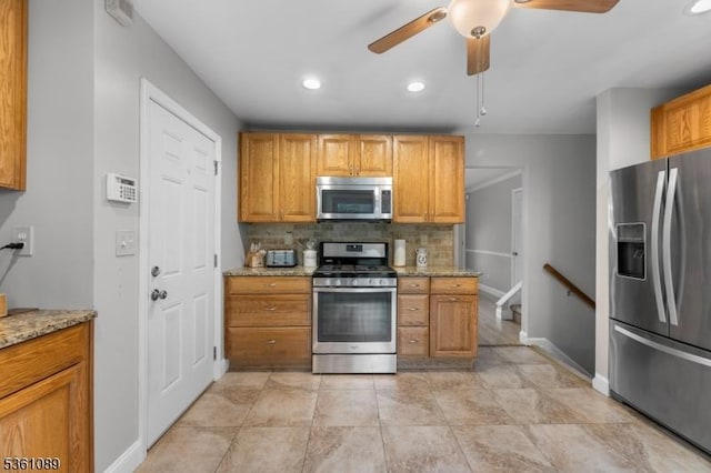 62 Valley View Rd, High Bridge Boro, NJ 08829 - kitchen featuring stainless steel appliances, tasteful backsplash, a ceiling fan, light stone counters, and baseboards
