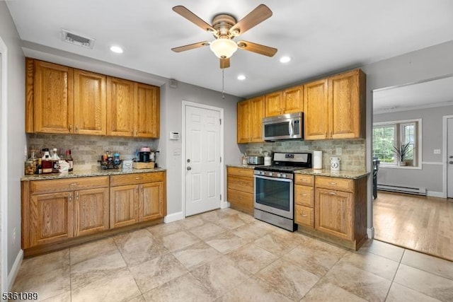 62 Valley View Rd, High Bridge Boro, NJ 08829 - kitchen with appliances with stainless steel finishes, baseboard heating, backsplash, ceiling fan, and recessed lighting