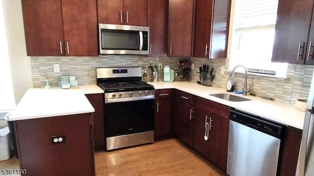 92 Sowers Dr Unit Cu92, Mount Olive Twp, NJ 07840 - kitchen featuring appliances with stainless steel finishes, a sink, light countertops, and tasteful backsplash