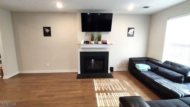 92 Sowers Dr Unit Cu92, Mount Olive Twp, NJ 07840 - living room with wood finished floors, a glass covered fireplace, baseboards, and recessed lighting