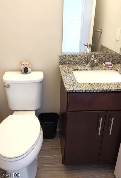 92 Sowers Dr Unit Cu92, Mount Olive Twp, NJ 07840 - bathroom with toilet, vanity, and wood finished floors