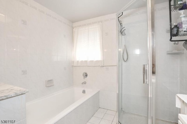328 Hoover Ave, Bloomfield Twp, NJ 07003 - bathroom with a stall shower, a bath, tile walls, tile patterned flooring, and vanity