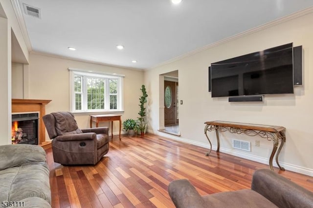 28 Sherbrook Dr, Berkeley Heights Twp, NJ 07922 - living area featuring wood-type flooring, crown molding, a lit fireplace, and recessed lighting