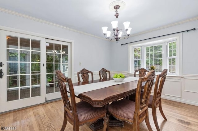 28 Sherbrook Dr, Berkeley Heights Twp, NJ 07922 - dining room with a chandelier, light wood-type flooring, ornamental molding, and a wainscoted wall