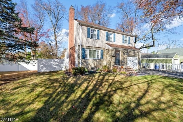 13 Henley Ave, Cranford Twp, NJ 07016 - traditional-style home featuring a chimney, an attached garage, and an outbuilding