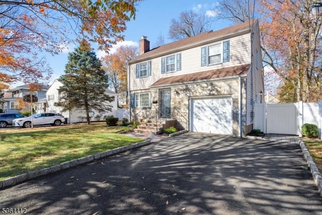 13 Henley Ave, Cranford Twp, NJ 07016 - view of front of property featuring a chimney, driveway, a garage, and stone siding