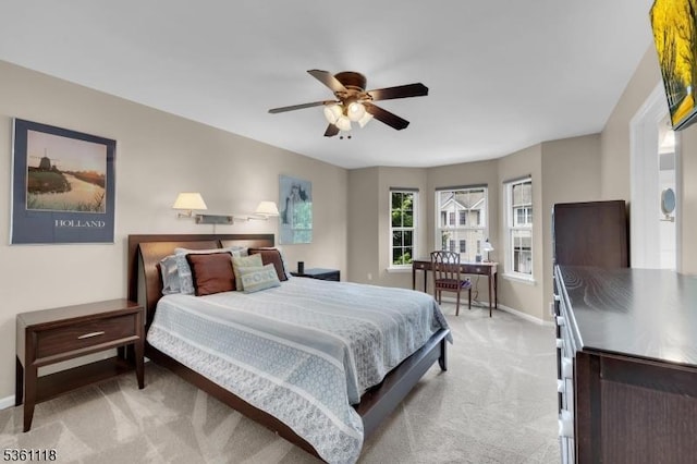 42 Rockcreek Ter Unit 42, Riverdale Boro, NJ 07457 - bedroom with light colored carpet, baseboards, and ceiling fan