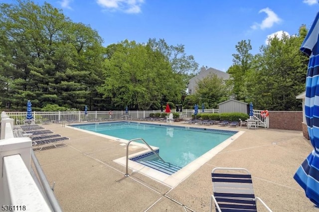 42 Rockcreek Ter Unit 42, Riverdale Boro, NJ 07457 - community pool with a patio area and an outdoor structure