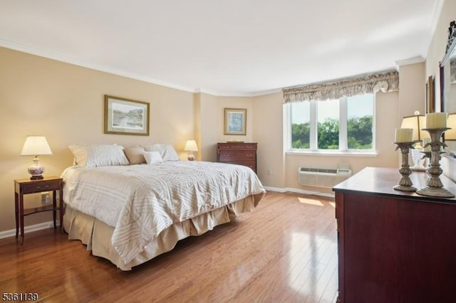10 Smith Manor Blvd Unit 514, West Orange Twp, NJ 07052 - bedroom featuring baseboards, crown molding, a wall mounted AC, and wood finished floors