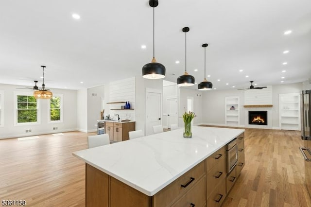 48 Hunterdon Blvd, Berkeley Heights Twp, NJ 07974 - kitchen featuring open floor plan, stainless steel microwave, ceiling fan, light wood-style flooring, and recessed lighting