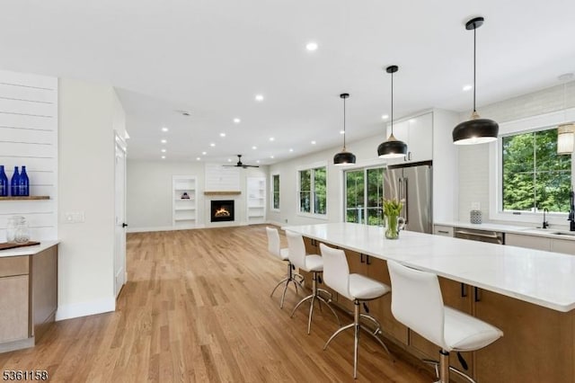 48 Hunterdon Blvd, Berkeley Heights Twp, NJ 07974 - kitchen featuring stainless steel appliances, light wood-style flooring, plenty of natural light, white cabinetry, and recessed lighting