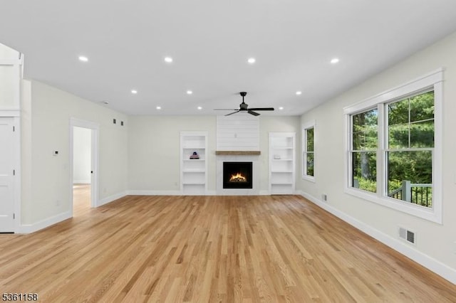 48 Hunterdon Blvd, Berkeley Heights Twp, NJ 07974 - unfurnished living room featuring a ceiling fan, recessed lighting, light wood-type flooring, built in features, and a fireplace