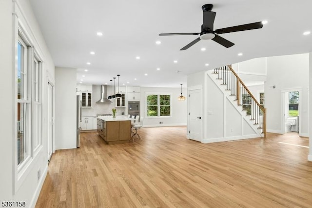 48 Hunterdon Blvd, Berkeley Heights Twp, NJ 07974 - unfurnished living room featuring stairway, light wood-type flooring, recessed lighting, and ceiling fan