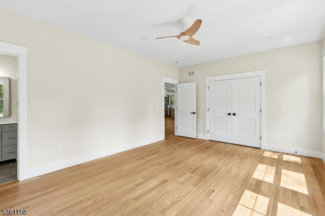 48 Hunterdon Blvd, Berkeley Heights Twp, NJ 07974 - unfurnished bedroom with light wood-style floors, a closet, connected bathroom, and a ceiling fan