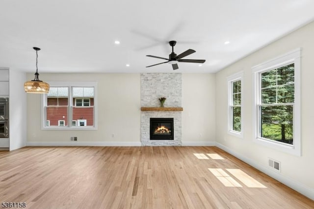 48 Hunterdon Blvd, Berkeley Heights Twp, NJ 07974 - unfurnished living room with light wood finished floors, healthy amount of natural light, a fireplace, a ceiling fan, and recessed lighting