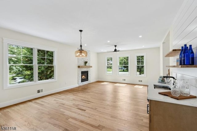 48 Hunterdon Blvd, Berkeley Heights Twp, NJ 07974 - unfurnished living room featuring a glass covered fireplace, a ceiling fan, light wood-type flooring, and recessed lighting