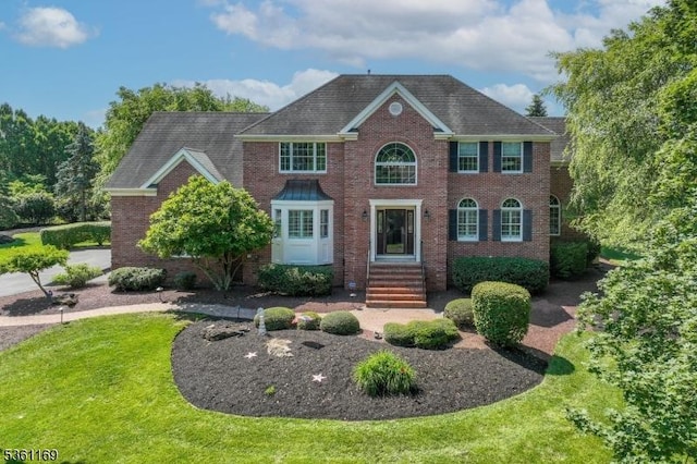 27 Horseshoe Dr, Hillsborough Twp, NJ 08844 - view of front of house with brick siding and a front lawn