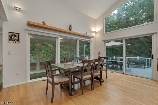 12 Fox Hollow Rd, Montville Twp, NJ 07045 - dining space featuring a towering ceiling, light wood finished floors, and baseboards