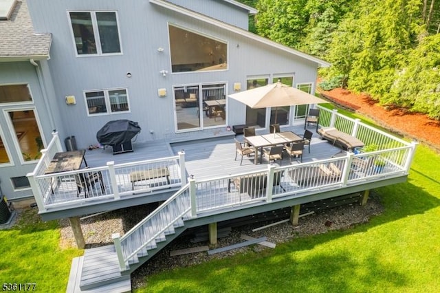 12 Fox Hollow Rd, Montville Twp, NJ 07045 - rear view of house with outdoor dining area, a wooden deck, and a yard