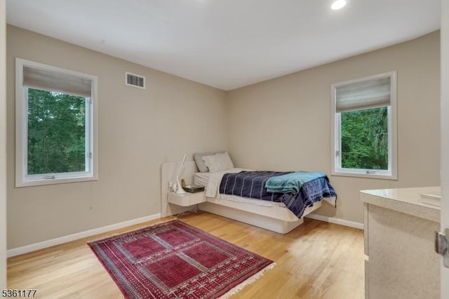 12 Fox Hollow Rd, Montville Twp, NJ 07045 - bedroom with multiple windows, light wood-style floors, baseboards, and recessed lighting