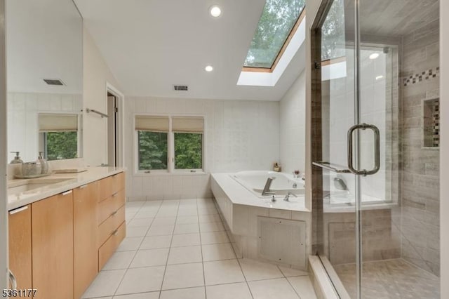 12 Fox Hollow Rd, Montville Twp, NJ 07045 - full bathroom featuring a skylight, vanity, a bath, tile patterned floors, and a stall shower