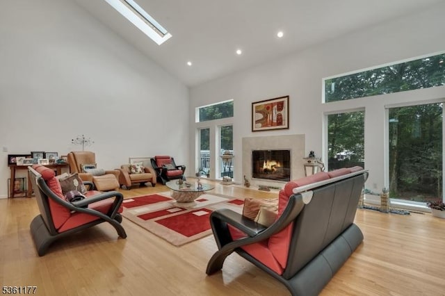 12 Fox Hollow Rd, Montville Twp, NJ 07045 - living room with high vaulted ceiling, a warm lit fireplace, wood finished floors, a skylight, and recessed lighting