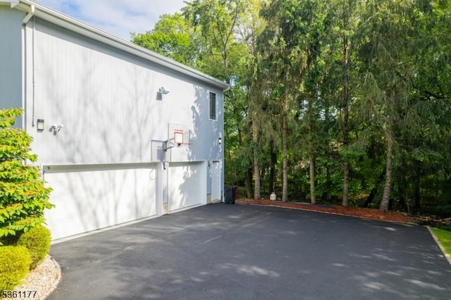 12 Fox Hollow Rd, Montville Twp, NJ 07045 - view of side of property with driveway and a garage