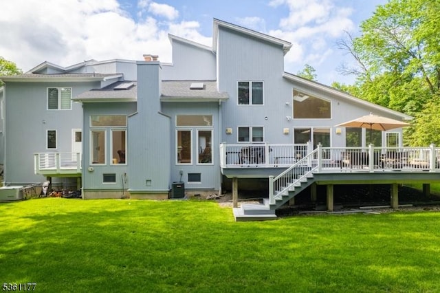 12 Fox Hollow Rd, Montville Twp, NJ 07045 - back of house featuring a wooden deck, a yard, stairway, and central AC