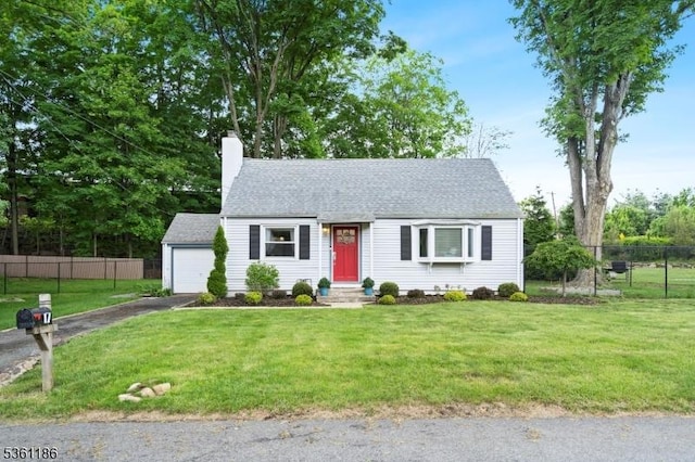 17 Woodstone Rd, Rockaway Boro, NJ 07866 - view of front of property featuring asphalt driveway, a chimney, roof with shingles, and a detached garage