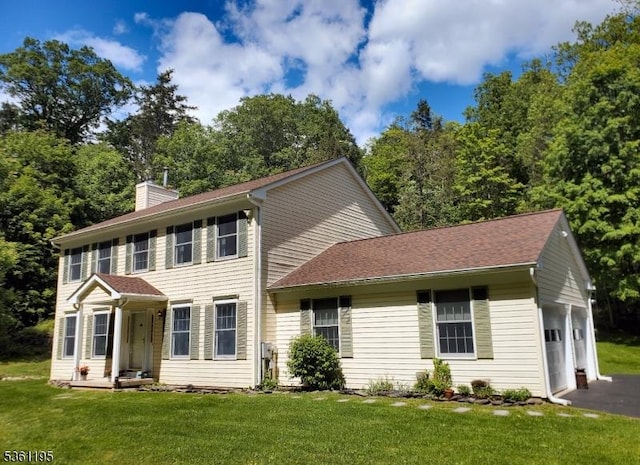 10A E Crisman Rd, Blairstown Twp, NJ 07825 - colonial home with a garage, a chimney, a front lawn, and driveway
