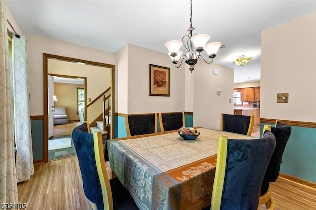 10A E Crisman Rd, Blairstown Twp, NJ 07825 - dining area with a chandelier, light wood-style flooring, and stairs