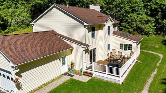 10A E Crisman Rd, Blairstown Twp, NJ 07825 - back of house with a chimney, a yard, a wooden deck, and outdoor dining area