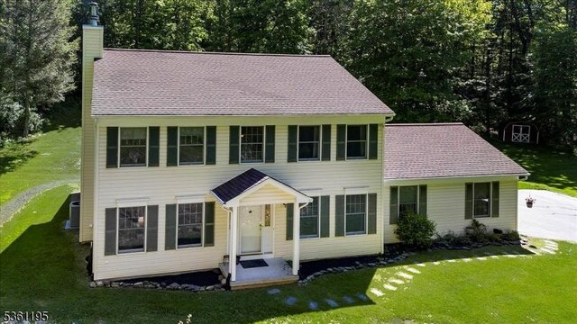 10A E Crisman Rd, Blairstown Twp, NJ 07825 - colonial home featuring a chimney and a front lawn