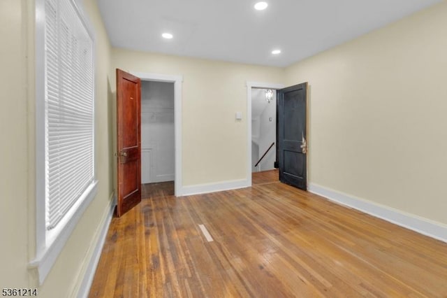 53 Elliot Pl, East Orange City, NJ 07018 - unfurnished bedroom featuring baseboards, wood-type flooring, a spacious closet, a closet, and recessed lighting