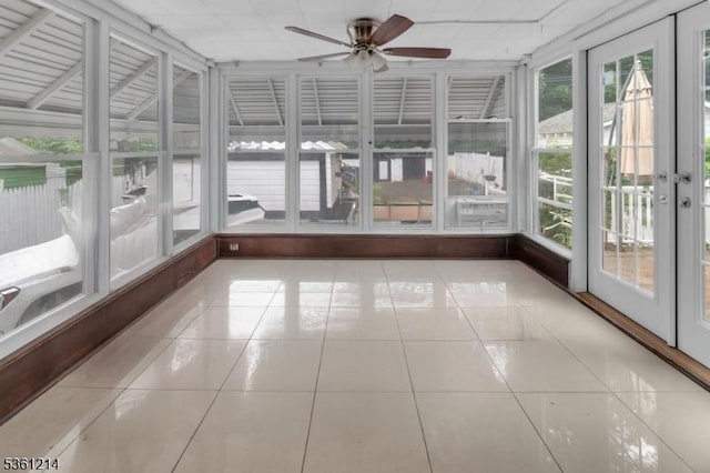 53 Elliot Pl, East Orange City, NJ 07018 - unfurnished sunroom with tile patterned floors and a drop ceiling